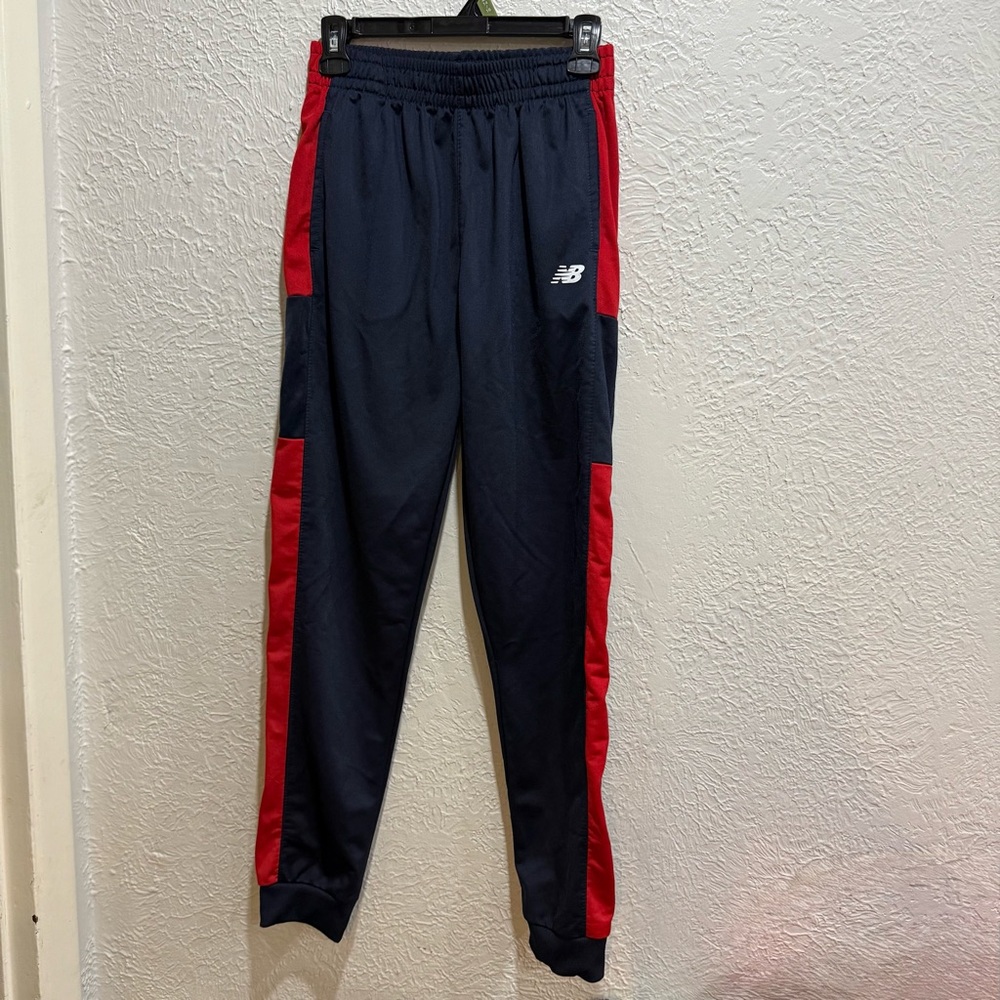 New Balance Boys Soft Gym jogger Black with red stripe along side size 18/20